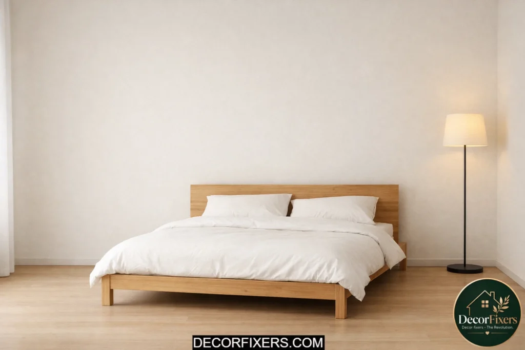 Minimal Scandinavian bedroom using negative space for a calm atmosphere.